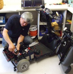 Martin servicing a scooter